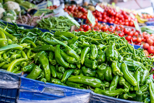 Fresh vegetable green pepper from a pile in a grocery. - Фото, изображение