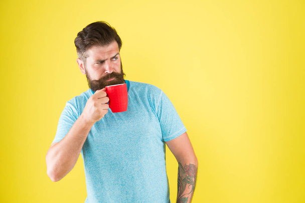 Just relaxing. hot drink mug. man casual style drink tea. good morning coffee. Morning tea for breakfast. break for lunch. sip of inspiration. Caucasian brutal hipster drinking beverage. copy space - Photo, image