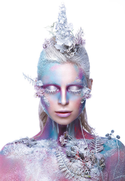Beautiful girl in the image of a snowy unicorn creature. Creative make up. Art look. - Foto, Imagen