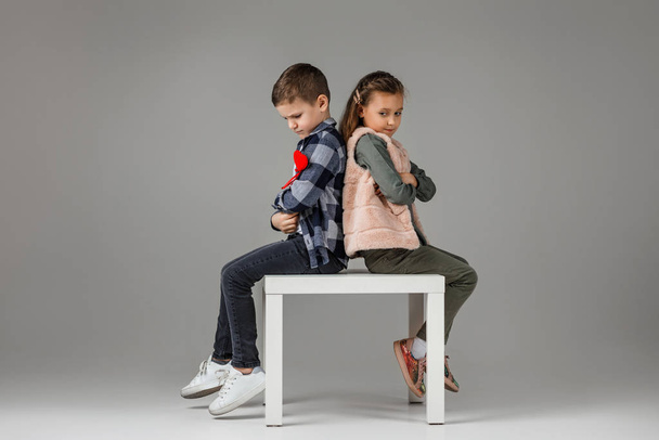 couple child girl and boy in fashionable clothes - 写真・画像