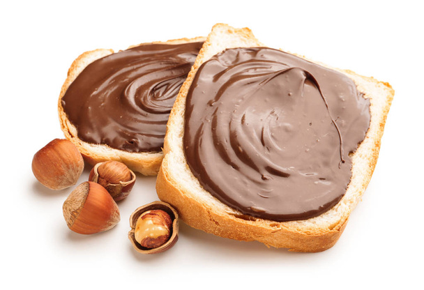 Fresh bread with chocolate paste on white background - Photo, Image