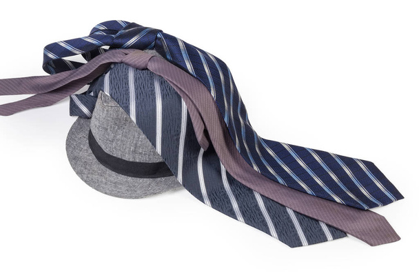 Men's ties lying on the lightweight cotton fedora hat - Fotoğraf, Görsel