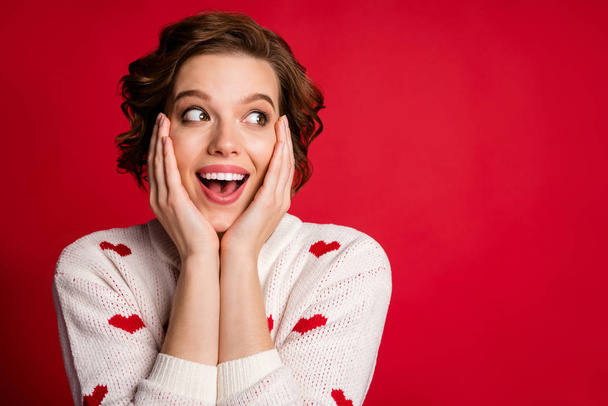 Close up photo of funny crazy astonished girl look incredible romantic information impressed scream wow omg touch face hands cheeks isolated over shine color background - Фото, зображення