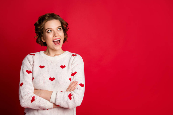Portrait of surprised crazy girlfriend look copy space see wonderful 14-february sales discounts wear white sweater isolated over shine color background - 写真・画像
