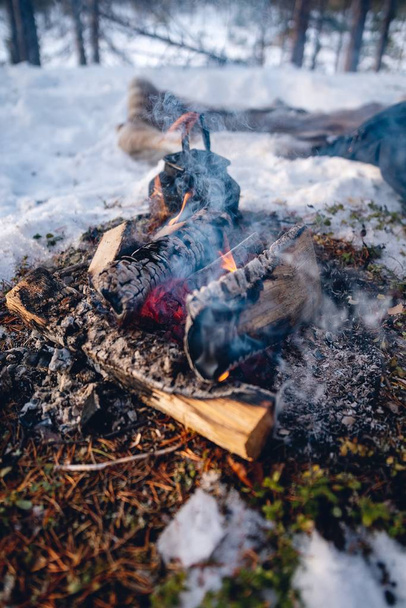 Vertical shot of wood burning in the north of Sweden - Foto, imagen