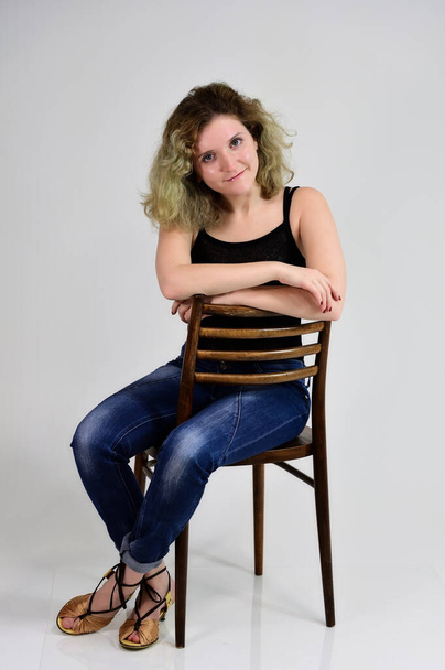 Portrait on a chair girl - Фото, изображение