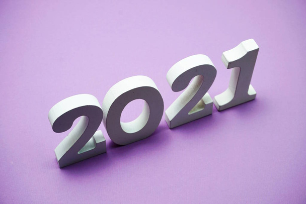 2021 Happy New Year with space copy on purple background - Fotoğraf, Görsel