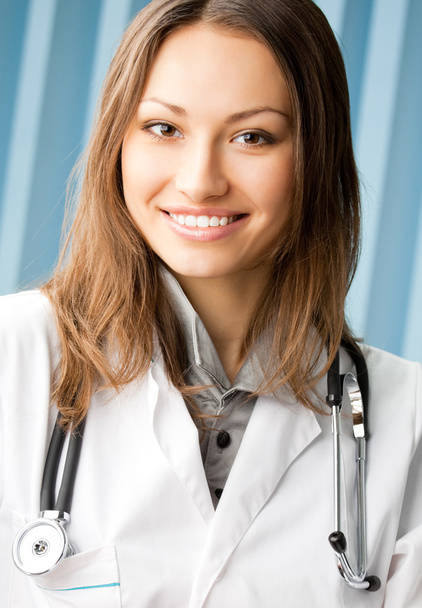 Cheerful female doctor at office - Фото, зображення