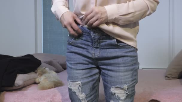 Woman fix top blouse in blue jeans - Materiał filmowy, wideo