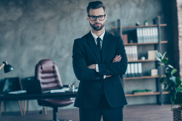 Photo of successful handsome business guy self-confident person company trainer arms crossed wear specs black blazer shirt tie pants belt suit costume standing office indoors - 写真・画像