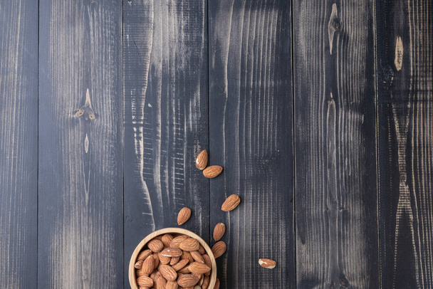 close up of almond on wooden plate - Foto, immagini