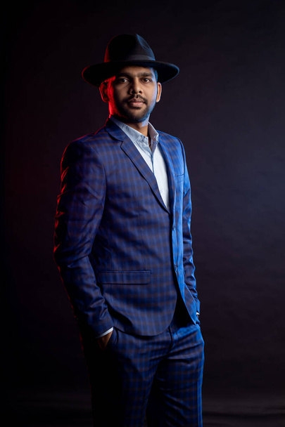 Indian young businessman on dark background - Photo, Image