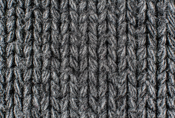 Textuur van grijs wollen gebreide trui closeup, macro - Foto, afbeelding