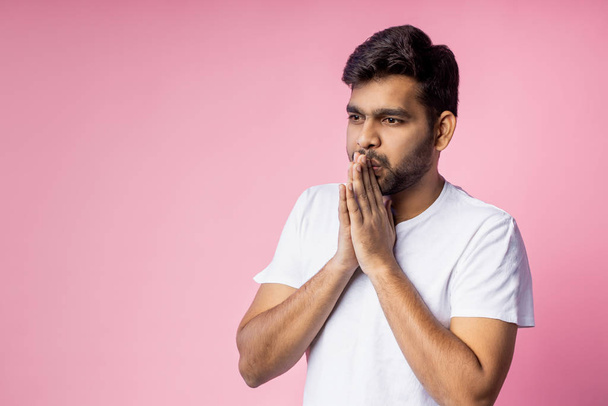 Portrait of handsome Indian guy standing on pink background - Фото, зображення