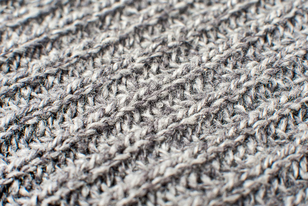 Textuur van grijs wollen gebreide trui closeup, macro - Foto, afbeelding
