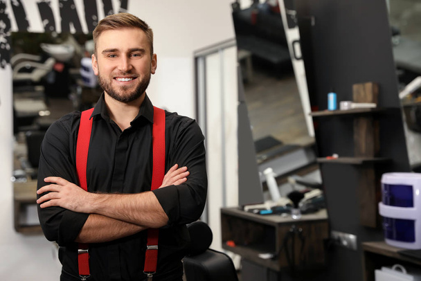 Young business owner in his barber shop - Photo, image