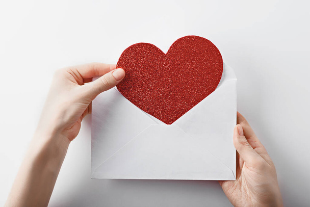 Declaration of love, heart with envelope in hands - Photo, Image