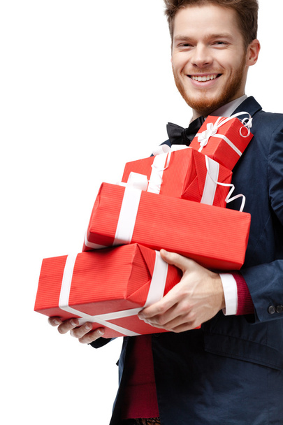 Man with a lot of presents - Фото, изображение