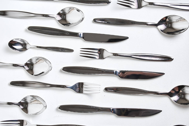 top view of forks, spoons and knives on white background    - Valokuva, kuva