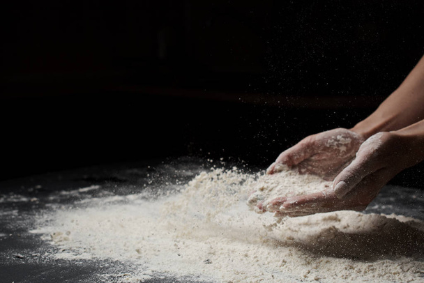 cropped shot of woman sifting flour and making dough  - Zdjęcie, obraz