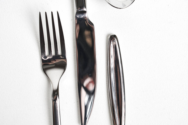 collection of shiny cutlery on white background, top view   - Φωτογραφία, εικόνα