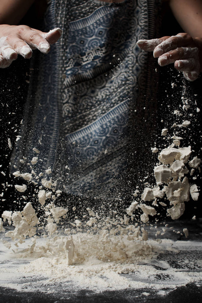 cropped shot of woman sifting flour and making dough  - 写真・画像