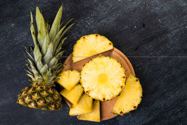 fresh pineapple on dark background - Valokuva, kuva