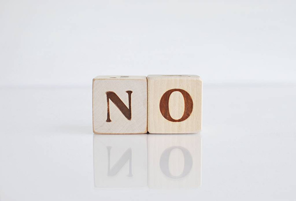 Word NO on white background with reflection. Negative answer. - Foto, immagini