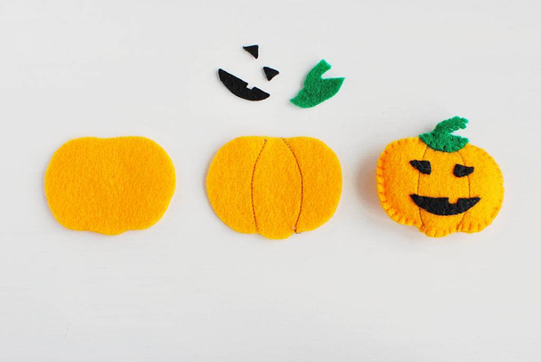 Halloween crafts. Tutorials step by step how to make felt pumpkin decoration. - Фото, изображение