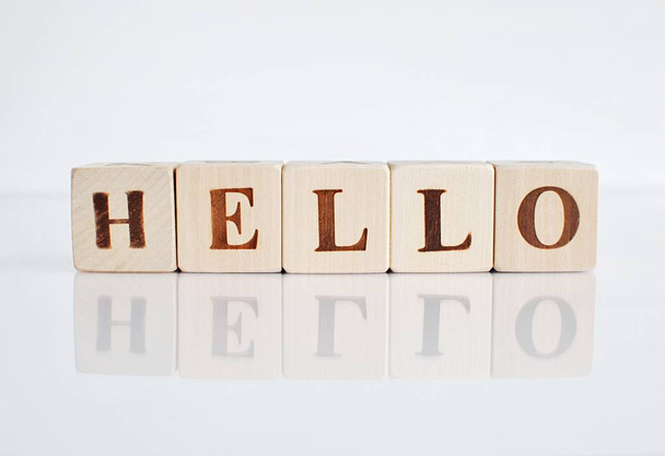 Word HELLO made from wooden blocks on white background - Photo, Image