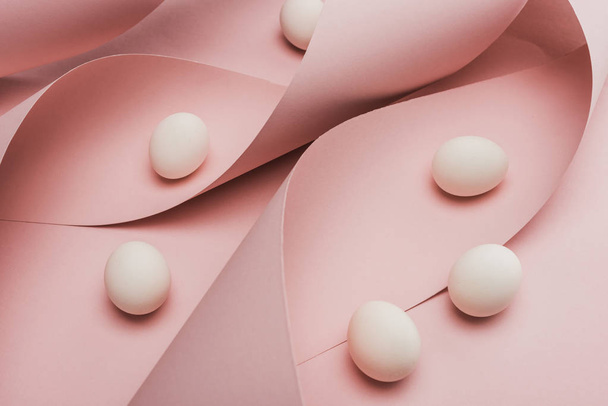 chicken eggs in spiral paper pink swirls  - Foto, Imagen
