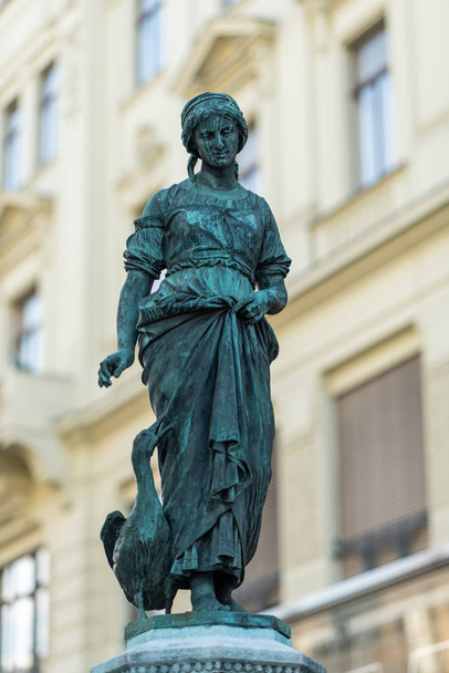 Statue of a girl with a goose, fountain in Vienna - Photo, Image