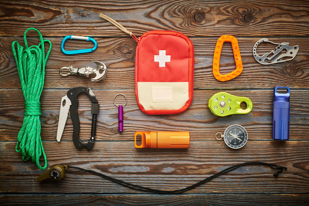 Travel items for hiking over wooden background - Zdjęcie, obraz