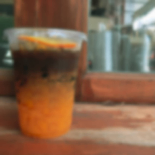Эспрессо с размытым фоном и апельсиновым соком
 - Фото, изображение