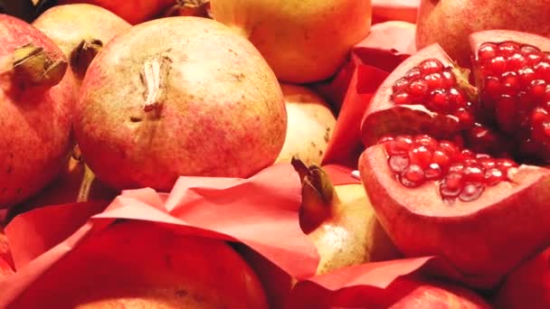 Close up of fresh juicy pomegranates on the market - Felvétel, videó