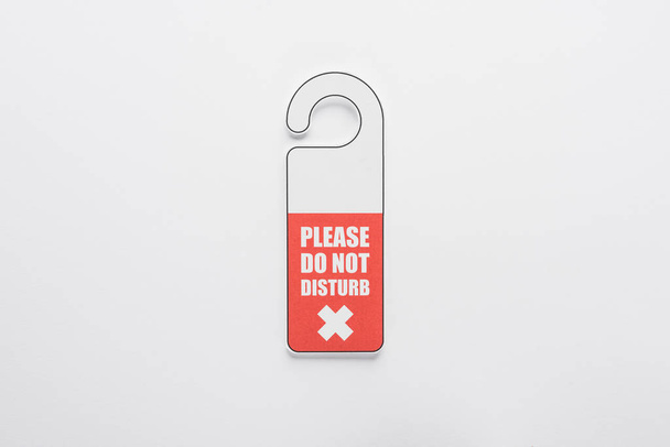 top view of please do no disturb sign on white background - Fotoğraf, Görsel