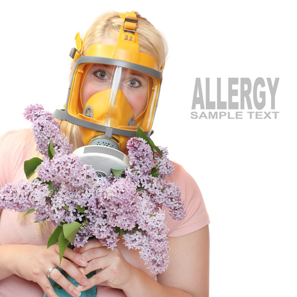 Woman with flowers in protection mask - Photo, Image