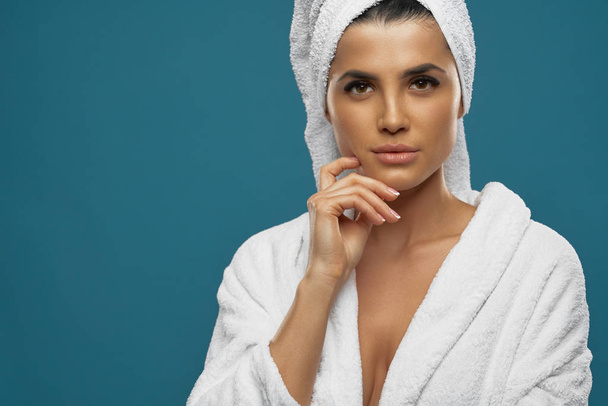Female in bathrobe and towel posing. - Foto, Imagem