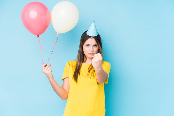 Young caucasian woman organizing a birthday isolated - Foto, Imagen
