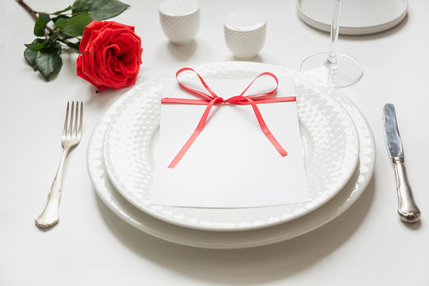 Valentines day or birthday dinner. Elegance table setting with red decor. - Photo, image
