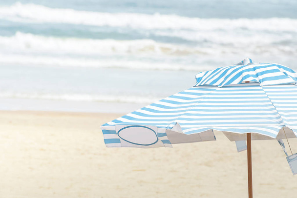Sunshade at the beach on a sunny day - Photo, Image