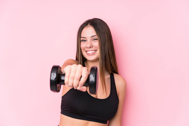 Young caucasian sporty woman holding a dumbbell - Photo, Image
