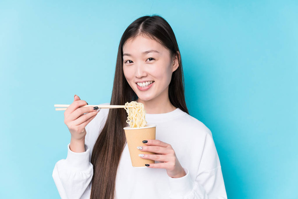 Young japanese woman eating noodles - Photo, Image