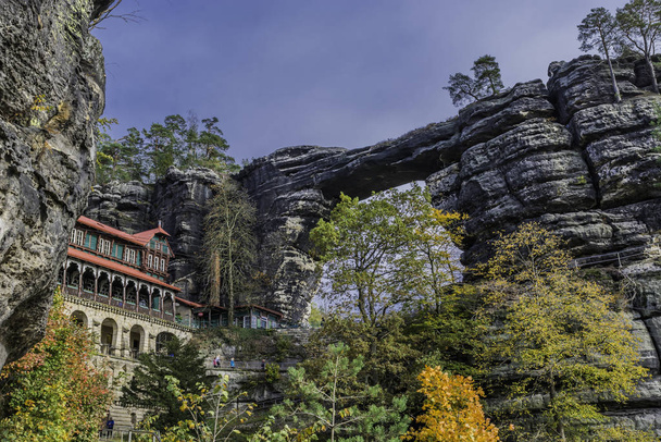 Summer palace - falcon nest (Sokoli hnizdo) and Pravcicka gate (the largest natural arch in Europe), Czech-Saxon Switzerland, Czech Republic in autumn colors - Photo, Image