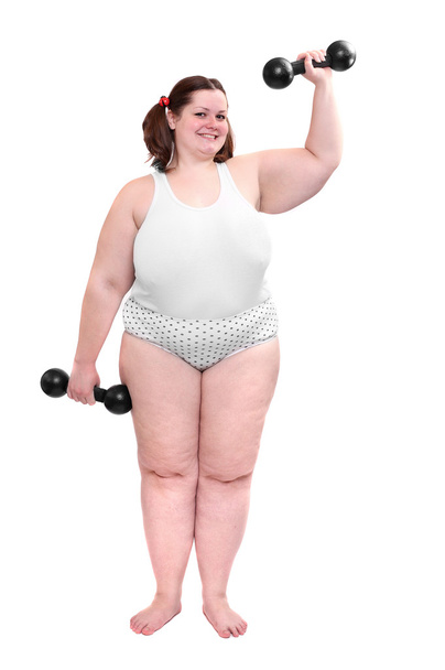 Heureuse femme en surpoids faisant de l'exercice sur fond blanc
. - Photo, image