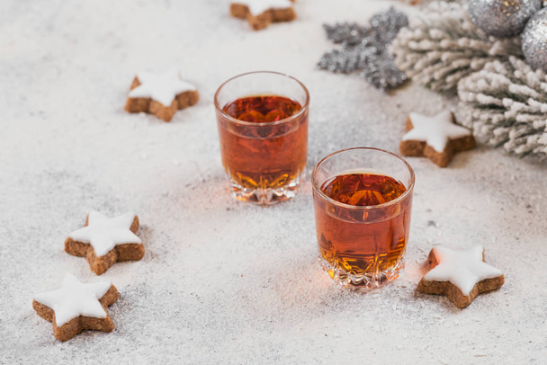 Whiskey, brandy or liquor, cookies and chrastmas decorations on  - Foto, Imagen