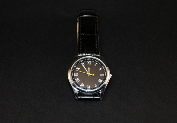 Mechanical watch with a leather strap on a black background. - Photo, Image