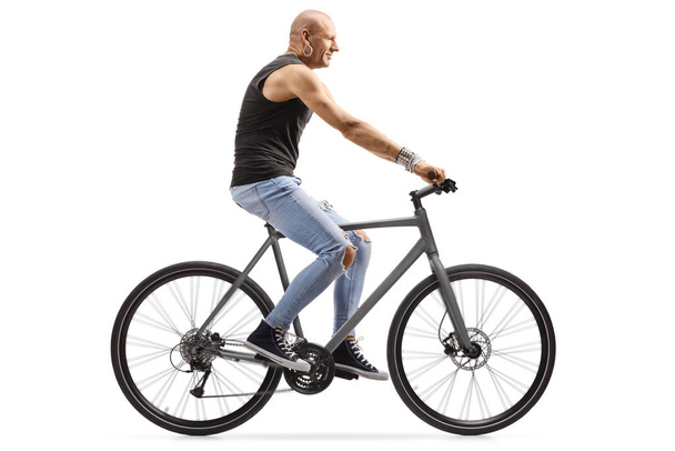 Bald man riding a bicycle - Фото, зображення