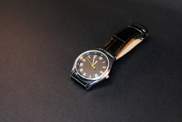 Mechanical watch with a leather strap on a black background. - Fotoğraf, Görsel
