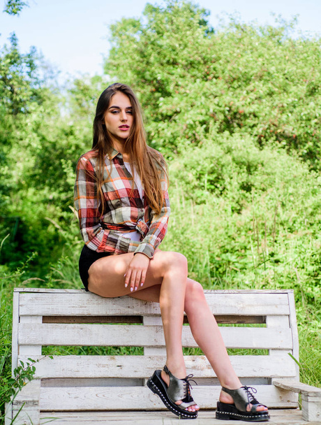 fit legs. trendy summer look. girl relax outdoor in park. spring trends. hairdresser and beauty salon. sensual fashion model in park. time to relax. fashion and beauty. sexy woman sit on bench - Zdjęcie, obraz